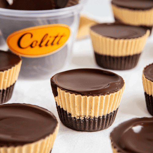 Creamy chocolate and peanut butter swirl mini cheesecakes in paper cups.