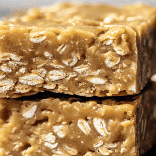 Chewy peanut butter oatmeal bars with visible oats and a golden hue.