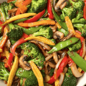 Crispy vegetable stir-fry with broccoli, bell peppers, snap peas, carrots, and mushrooms.