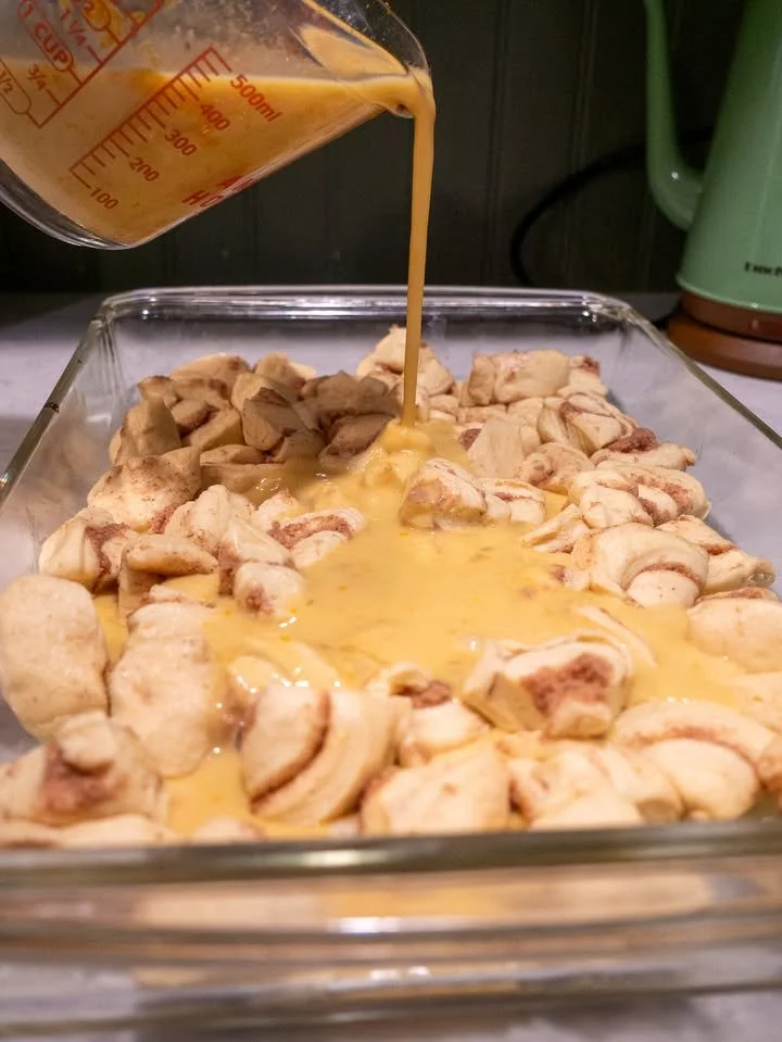 Delicious homemade cinnamon rolls topped with icing and sprinkled with cinnamon.