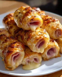 Delicious ham and cheese sticks served on a plate